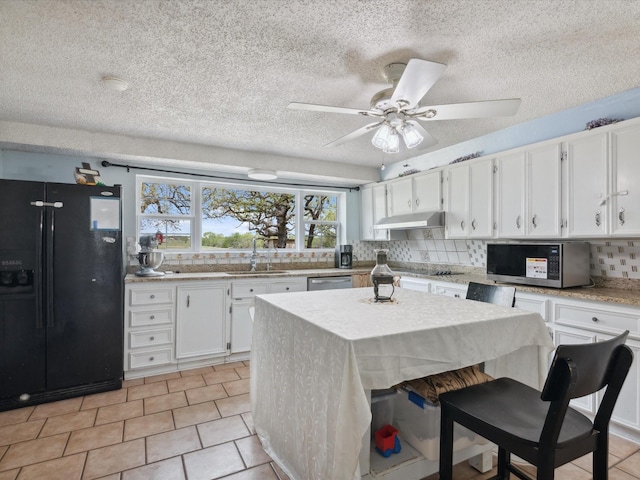kitchen featuring under cabinet range hood, decorative backsplash, a sink, white cabinets, and black appliances