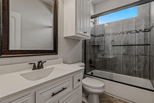 1596 Mannheim Dr, Rockwall, TX 75032 - full bathroom featuring vanity, enclosed tub / shower combo, and toilet