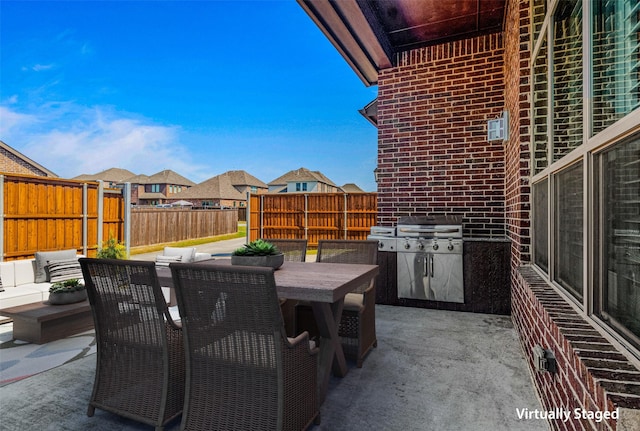 1596 Mannheim Dr, Rockwall, TX 75032 - view of patio / terrace featuring a residential view, outdoor dining space, a fenced backyard, and an outdoor hangout area