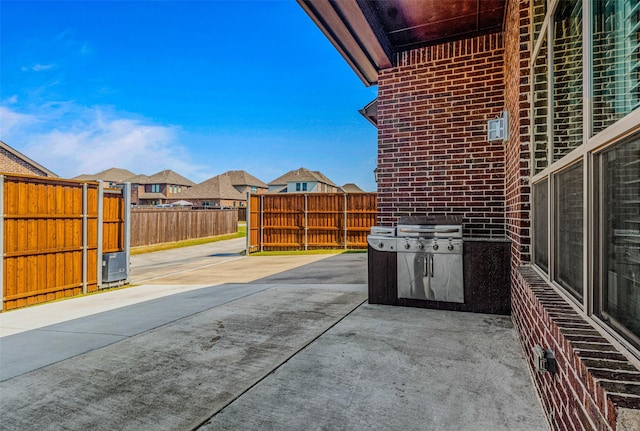 1596 Mannheim Dr, Rockwall, TX 75032 - view of patio / terrace featuring a fenced backyard and a residential view