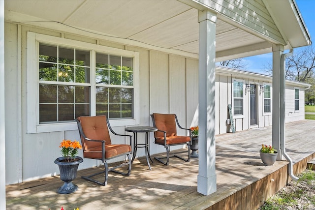 wooden terrace featuring a porch