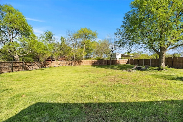 view of yard featuring a fenced backyard