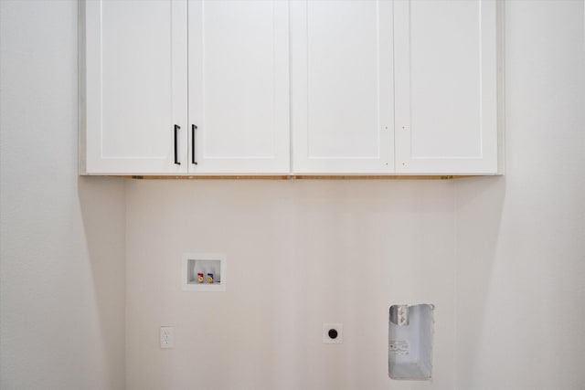 laundry area featuring electric dryer hookup, cabinet space, and washer hookup