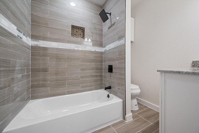 full bathroom with toilet, baseboards, vanity, and bathing tub / shower combination