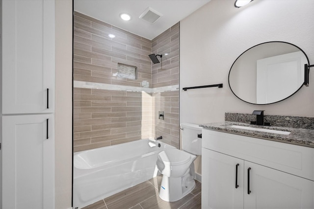 full bathroom featuring shower / bath combination, toilet, vanity, and wood finish floors