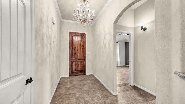 4315 Logan Cir, Granbury, TX 76049 - hall featuring arched walkways, crown molding, baseboards, and a chandelier