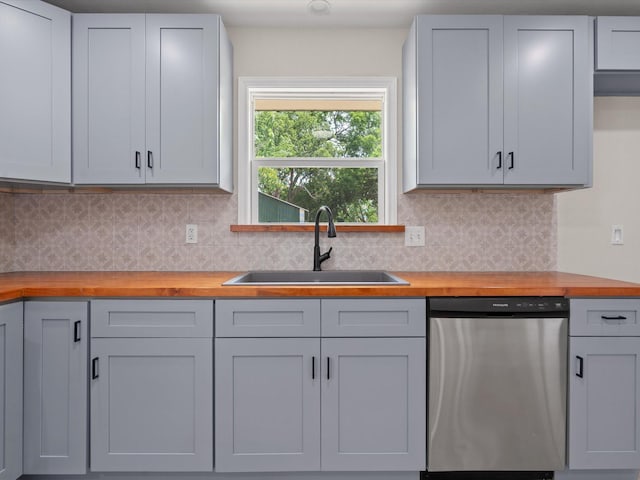5134 Anderson Cir, Garland, TX 75043 - kitchen with stainless steel dishwasher, wood counters, a sink, and backsplash