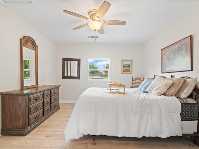 5134 Anderson Cir, Garland, TX 75043 - bedroom with light wood finished floors, baseboards, and ceiling fan