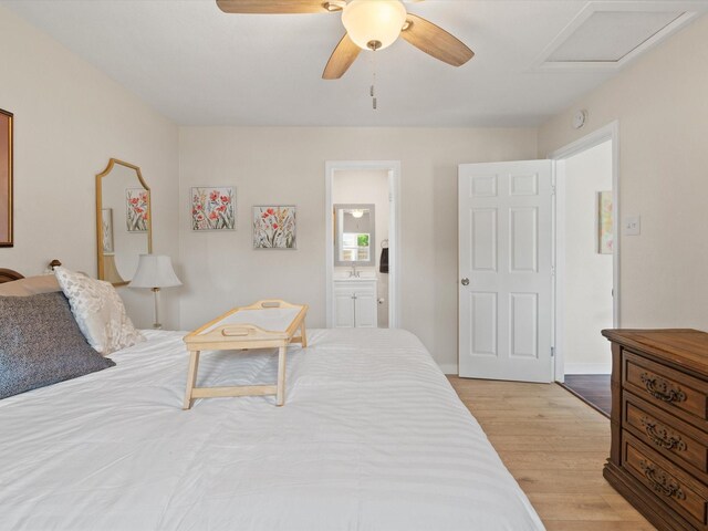 5134 Anderson Cir, Garland, TX 75043 - bedroom featuring attic access, light wood finished floors, a ceiling fan, and ensuite bathroom