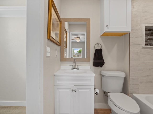 5134 Anderson Cir, Garland, TX 75043 - full bath featuring vanity, toilet, baseboards, and a ceiling fan