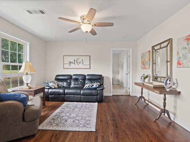 5134 Anderson Cir, Garland, TX 75043 - living area featuring dark wood finished floors, a ceiling fan, and baseboards
