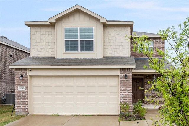 view of front of home featuring brick siding, fence, driveway, and an attached garage