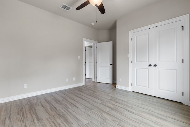 2685 Thompson Rd, Weatherford, TX 76087 - unfurnished bedroom featuring light wood-type flooring, a closet, baseboards, and ceiling fan