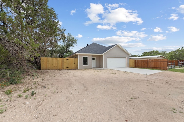 2685 Thompson Rd, Weatherford, TX 76087 - view of front facade with driveway, an attached garage, and a gate
