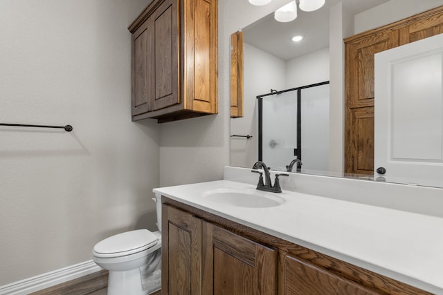 2685 Thompson Rd, Weatherford, TX 76087 - bathroom featuring a stall shower, vanity, toilet, baseboards, and wood finished floors