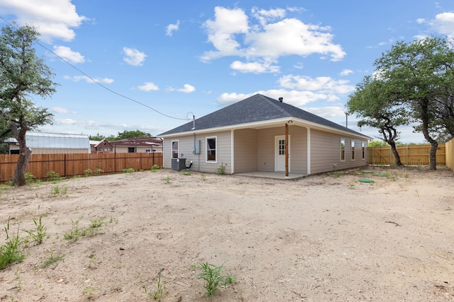 2685 Thompson Rd, Weatherford, TX 76087 - back of house featuring a fenced backyard, a patio area, and central AC unit