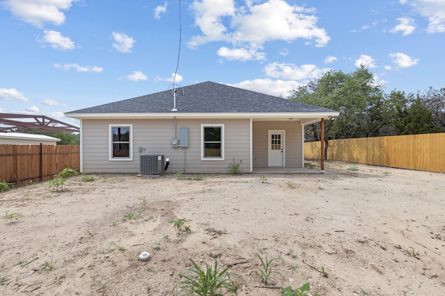 2685 Thompson Rd, Weatherford, TX 76087 - back of property with cooling unit, a fenced backyard, a patio, and a shingled roof