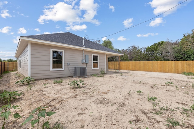 2685 Thompson Rd, Weatherford, TX 76087 - rear view of property with a fenced backyard, central AC, and a shingled roof