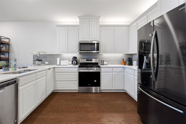 7223 Sideoats Gama St, Frisco, TX 75033 - kitchen with stainless steel appliances, a sink, backsplash, white cabinets, and light countertops