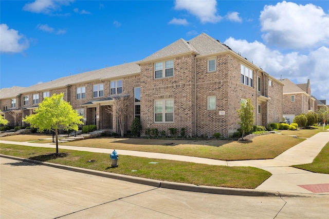 7223 Sideoats Gama St, Frisco, TX 75033 - view of front of property with brick siding, a residential view, and a front lawn