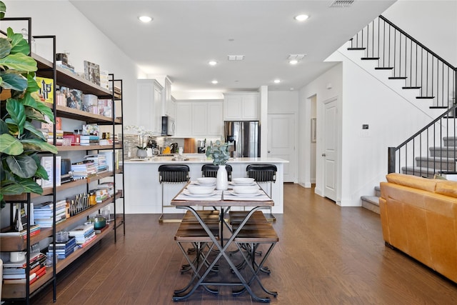 7223 Sideoats Gama St, Frisco, TX 75033 - dining space with dark wood-style flooring, stairs, and recessed lighting