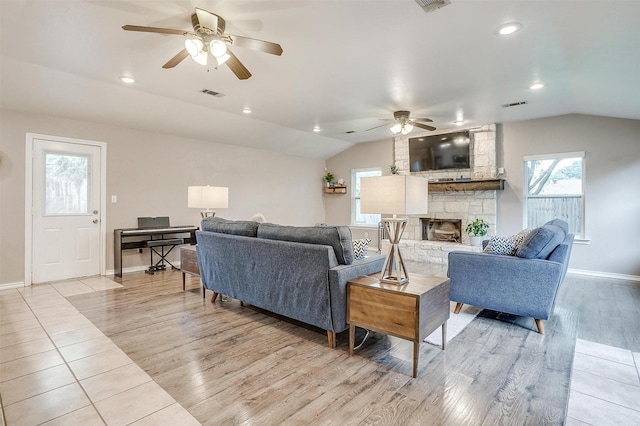 136 NW Suzanne Ter, Burleson, TX 76028 - living area with lofted ceiling, ceiling fan, light wood-style flooring, a fireplace, and baseboards