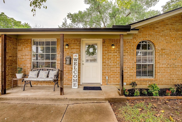 136 NW Suzanne Ter, Burleson, TX 76028 - property entrance with brick siding and covered porch
