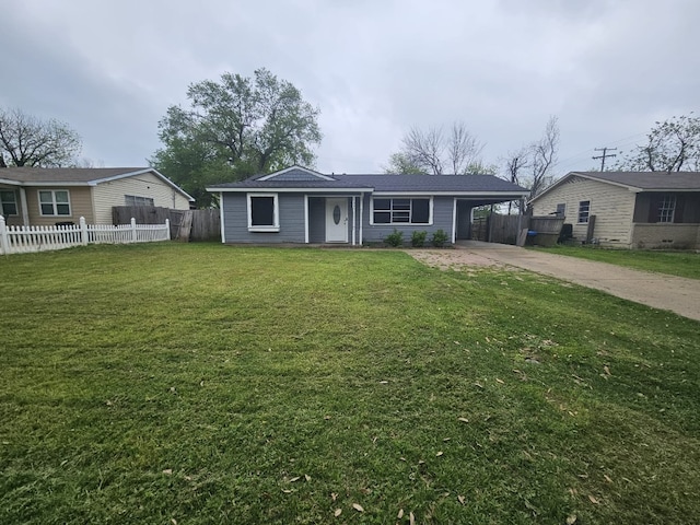 view of front of house featuring a front yard, a carport, fence, and concrete driveway