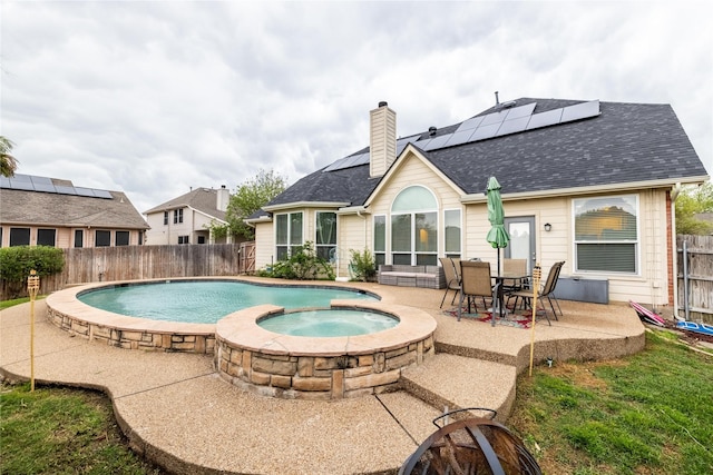 view of pool with a fenced backyard, a patio area, and a pool with connected hot tub