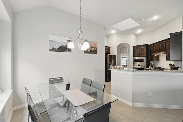 1125 Overton St, Frisco, TX 75036 - dining room featuring arched walkways, a chandelier, light tile patterned floors, vaulted ceiling, and recessed lighting