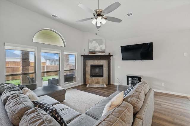 1125 Overton St, Frisco, TX 75036 - living room featuring ceiling fan, wood finished floors, lofted ceiling, baseboards, and a fireplace