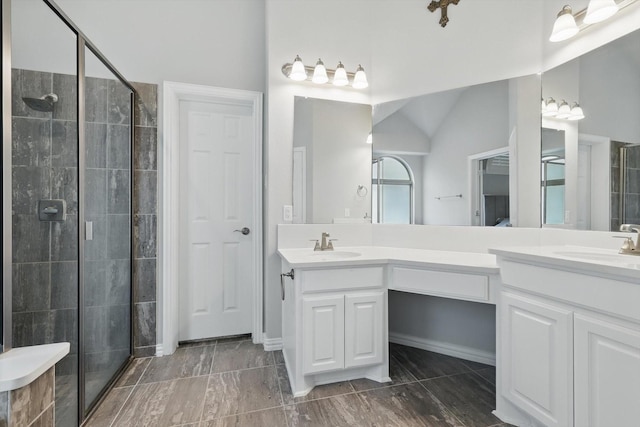 1125 Overton St, Frisco, TX 75036 - bathroom featuring a stall shower, double vanity, and vaulted ceiling