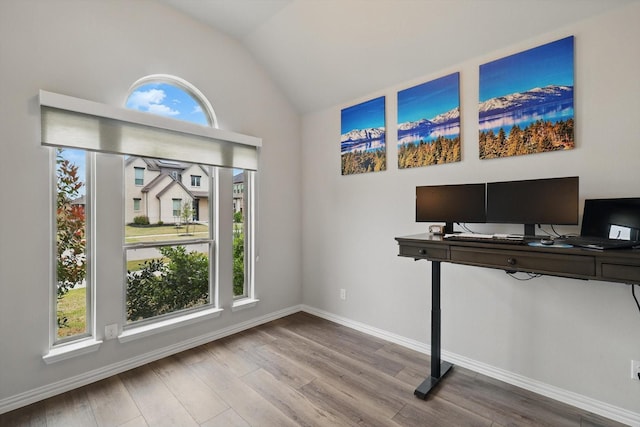 1125 Overton St, Frisco, TX 75036 - unfurnished office featuring plenty of natural light, vaulted ceiling, wood finished floors, and baseboards