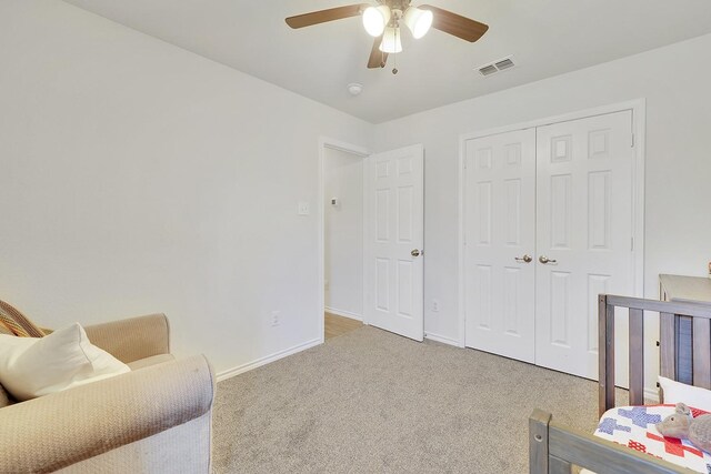 bedroom with carpet, baseboards, a closet, and ceiling fan