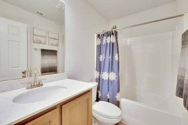 full bath featuring toilet, shower / bath combo, and vanity