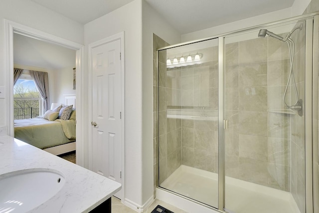 ensuite bathroom with a shower stall and vanity