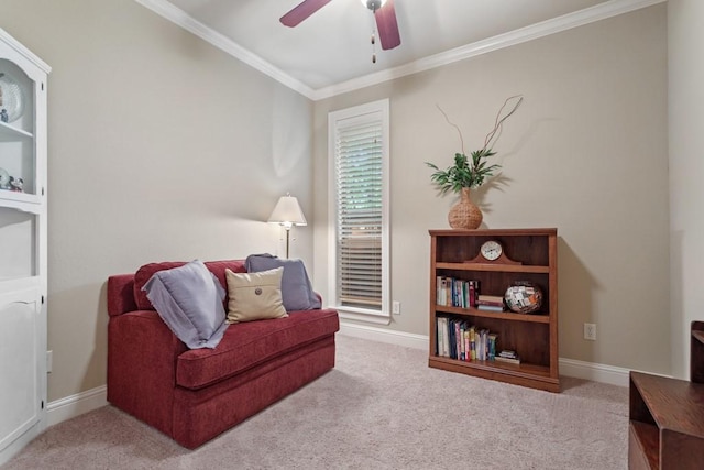 sitting room featuring ornamental molding, carpet flooring, and ceiling fan