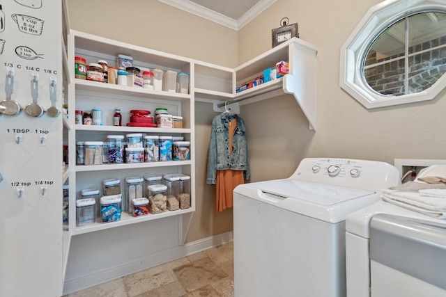 washroom featuring washing machine and dryer, baseboards, laundry area, and ornamental molding
