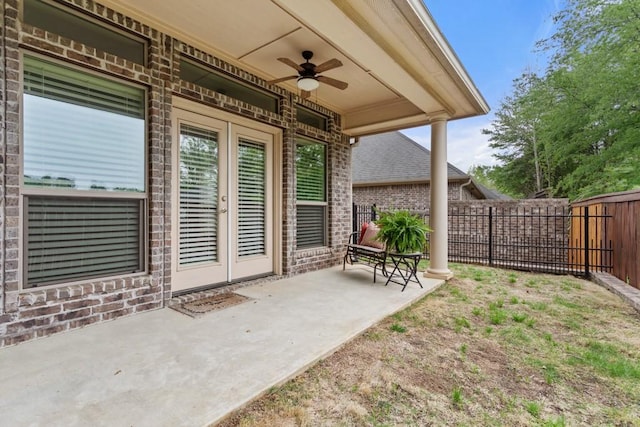 view of patio / terrace with fence and ceiling fan