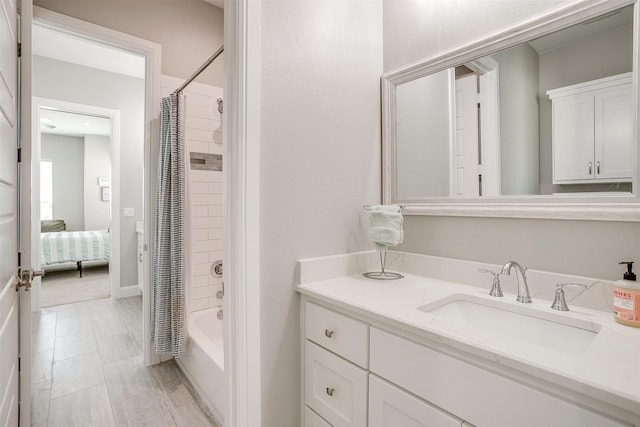 bathroom featuring vanity and shower / tub combo with curtain