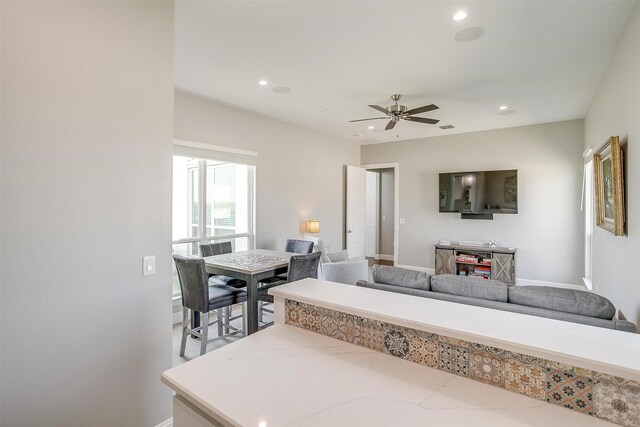 living room with recessed lighting, visible vents, baseboards, and a ceiling fan