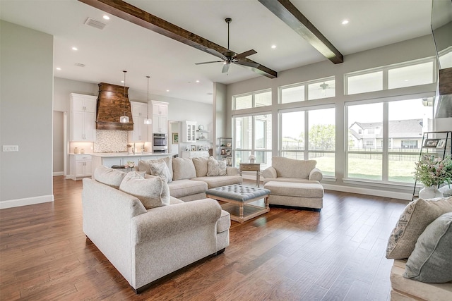living room featuring baseboards, ceiling fan, beam ceiling, recessed lighting, and dark wood-type flooring