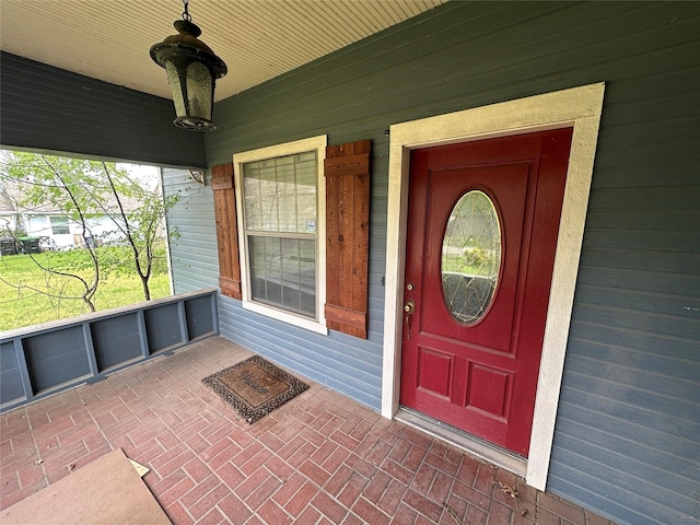 301 E White St, Pilot Point, TX 76258 - view of exterior entry featuring a porch