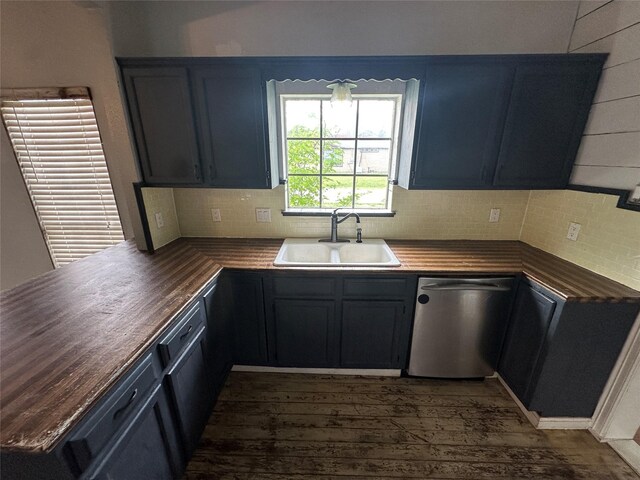 301 E White St, Pilot Point, TX 76258 - kitchen with stainless steel dishwasher, a sink, wood counters, dark wood finished floors, and tasteful backsplash