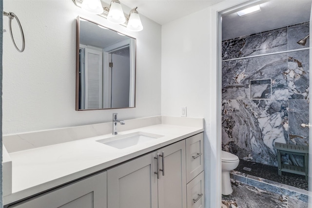 6050 Birchbrook Dr Unit 142, Dallas, TX 75206 - full bath featuring toilet, vanity, a marble finish shower, and marble finish floors