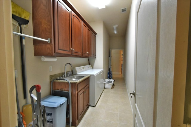 13111 Saint Orlin Way, Talty, TX 75126 - laundry room featuring cabinet space, washer and dryer, and light tile patterned flooring