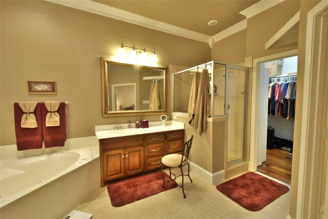 13111 Saint Orlin Way, Talty, TX 75126 - bathroom with a shower stall, ornamental molding, vanity, a bath, and a walk in closet