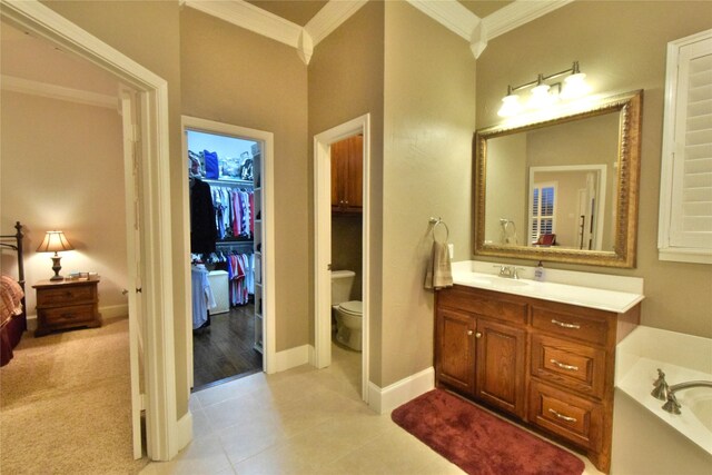 13111 Saint Orlin Way, Talty, TX 75126 - full bath featuring ornamental molding, toilet, vanity, a garden tub, and baseboards