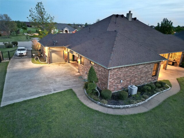 13111 Saint Orlin Way, Talty, TX 75126 - view of home's exterior featuring roof with shingles, a gate, a garage, brick siding, and driveway