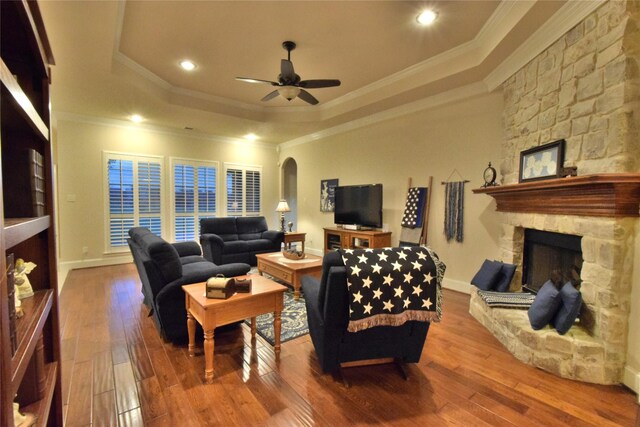 13111 Saint Orlin Way, Talty, TX 75126 - living room with a raised ceiling, a fireplace, ornamental molding, ceiling fan, and hardwood / wood-style flooring